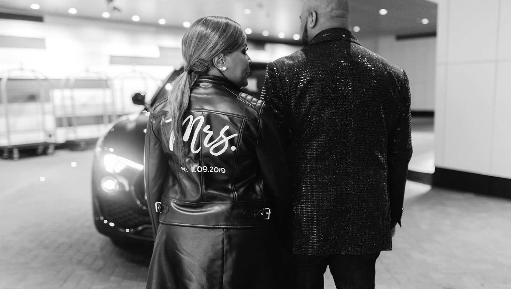 Bride with custom leather jacket & groom