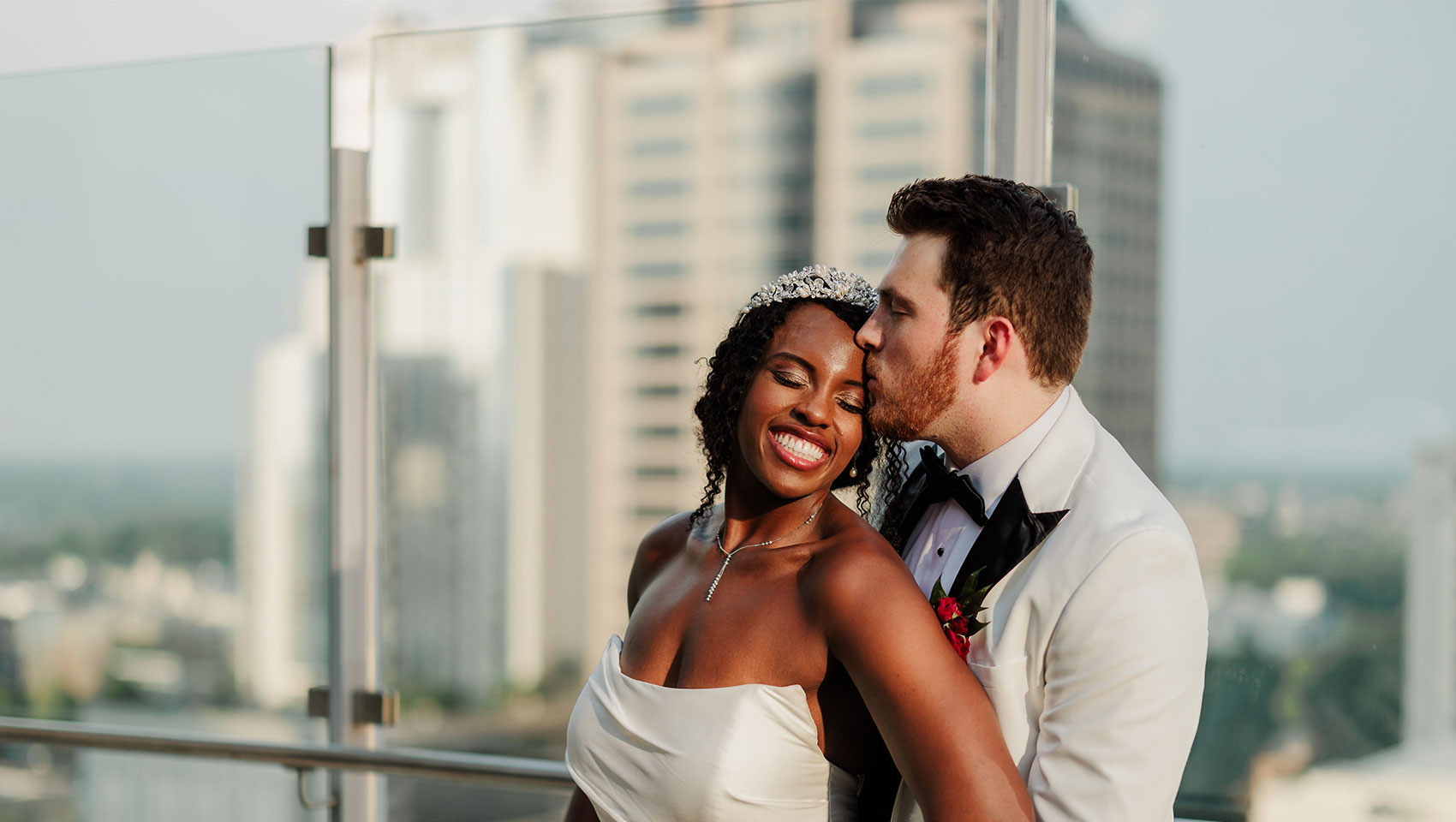 Newlyweds in front of hotel