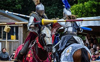 Knights on horseback jousting
