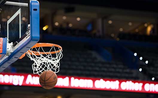 Basketball going in hoop